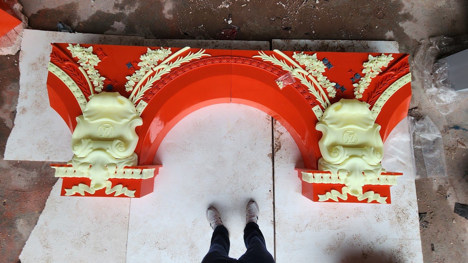Louis Vuitton red campaign archway in primer at the 3D Forger atelier — before final colour